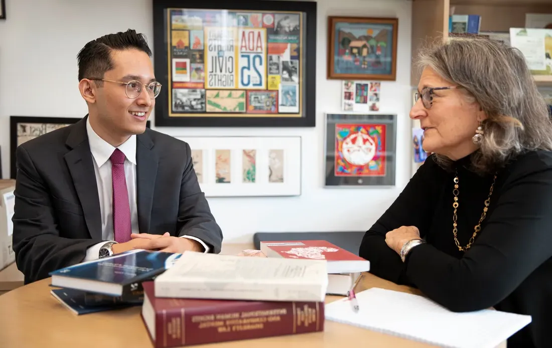 Student Matthew Yanez, sitting with Professor Kanter.